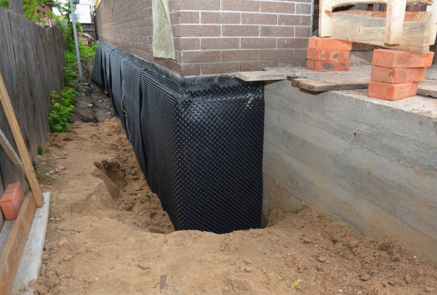 Happy homeowners after waterproofing job in Webster